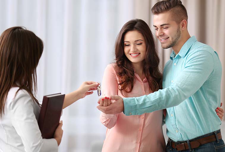 Family getting keys to new home image